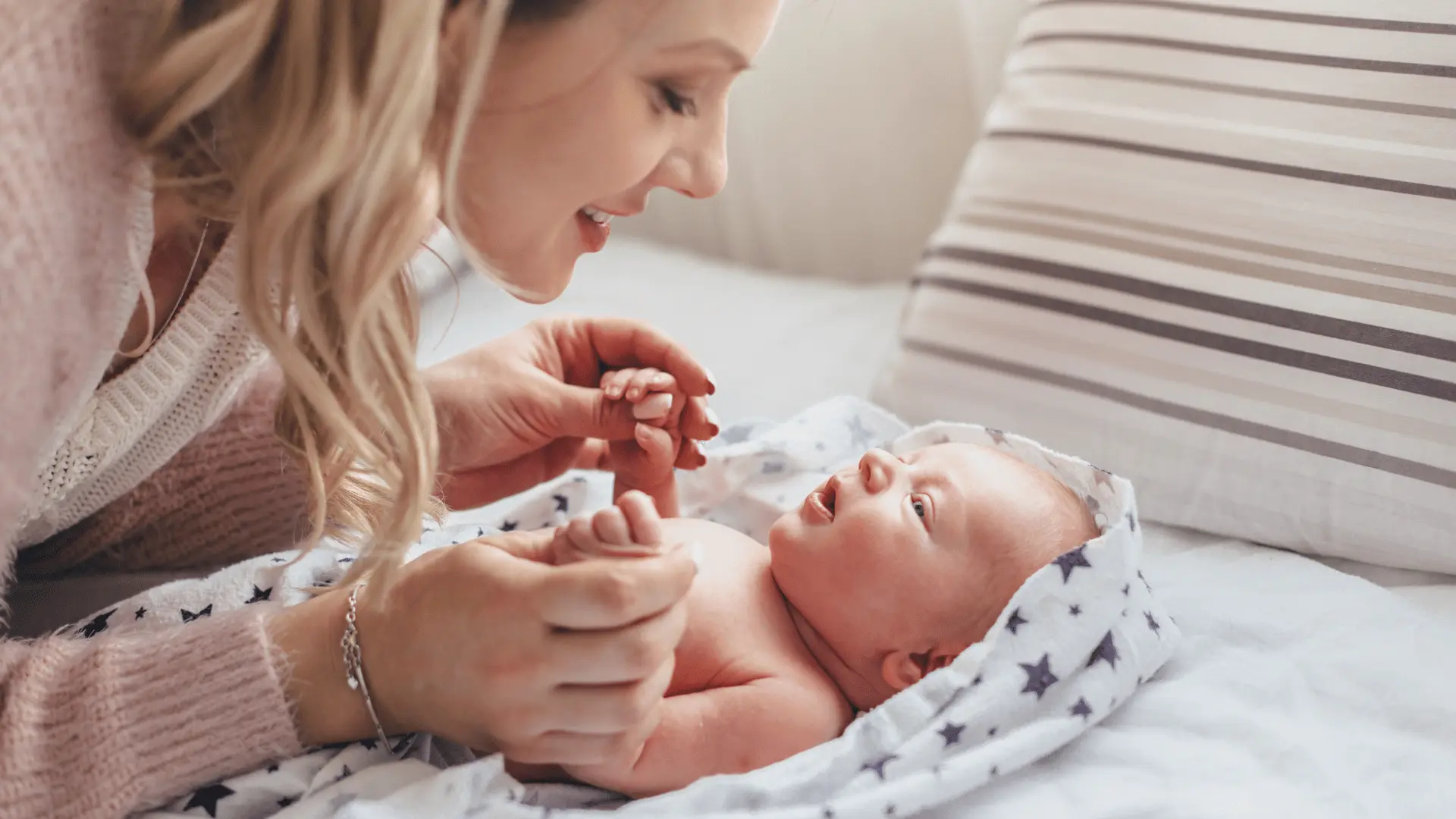 New mother bonding with her newborn baby after birth